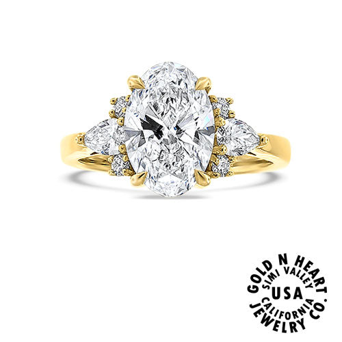 Oval-cut Center Framed by Matching Pear Shape Diamonds Engagement Ring